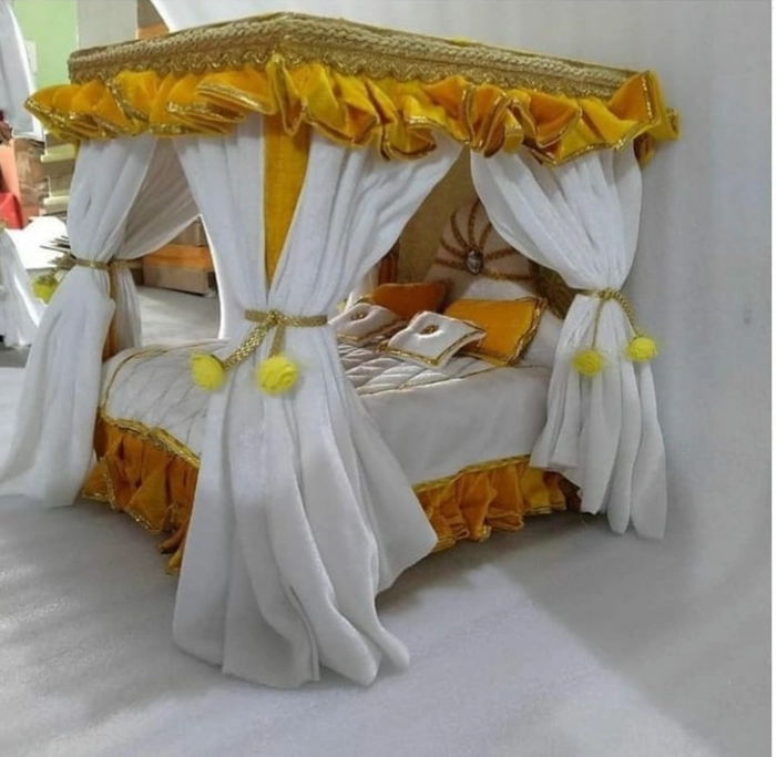 Yellow and white colour wooden bed