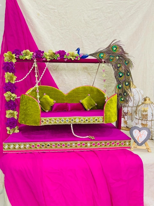 Beautifully crafted wooden swing (jhula) for Laddu Gopal Ji, adorned with peacock feathers