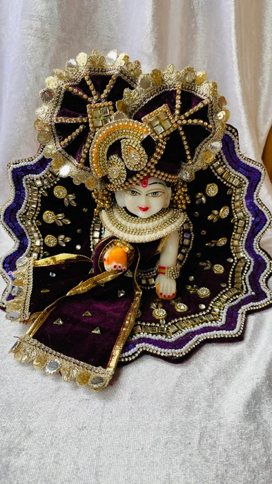 A beautiful designer Laddu Gopal Ji dress set with full handwork Kundan embroidery in a vine color