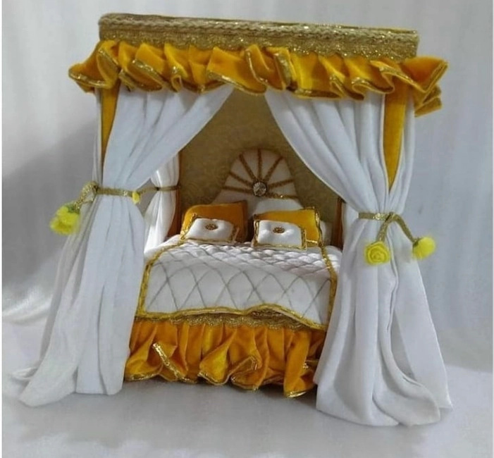Yellow and white colour wooden bed